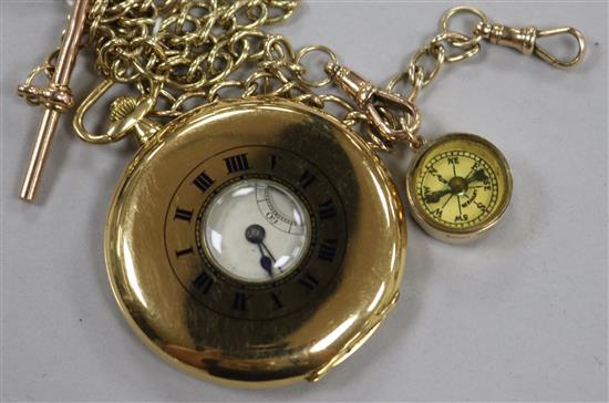 A George V 18ct gold Tavannes Watch Co. half hunter dress pocket watch and a 9ct gold albert with 9ct gold compass charm,